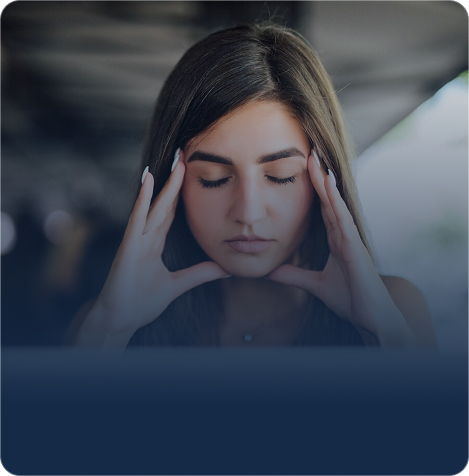 Woman pausing with her hands at her temples