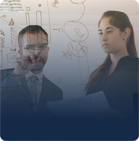 Woman and man working together at a glass planning board